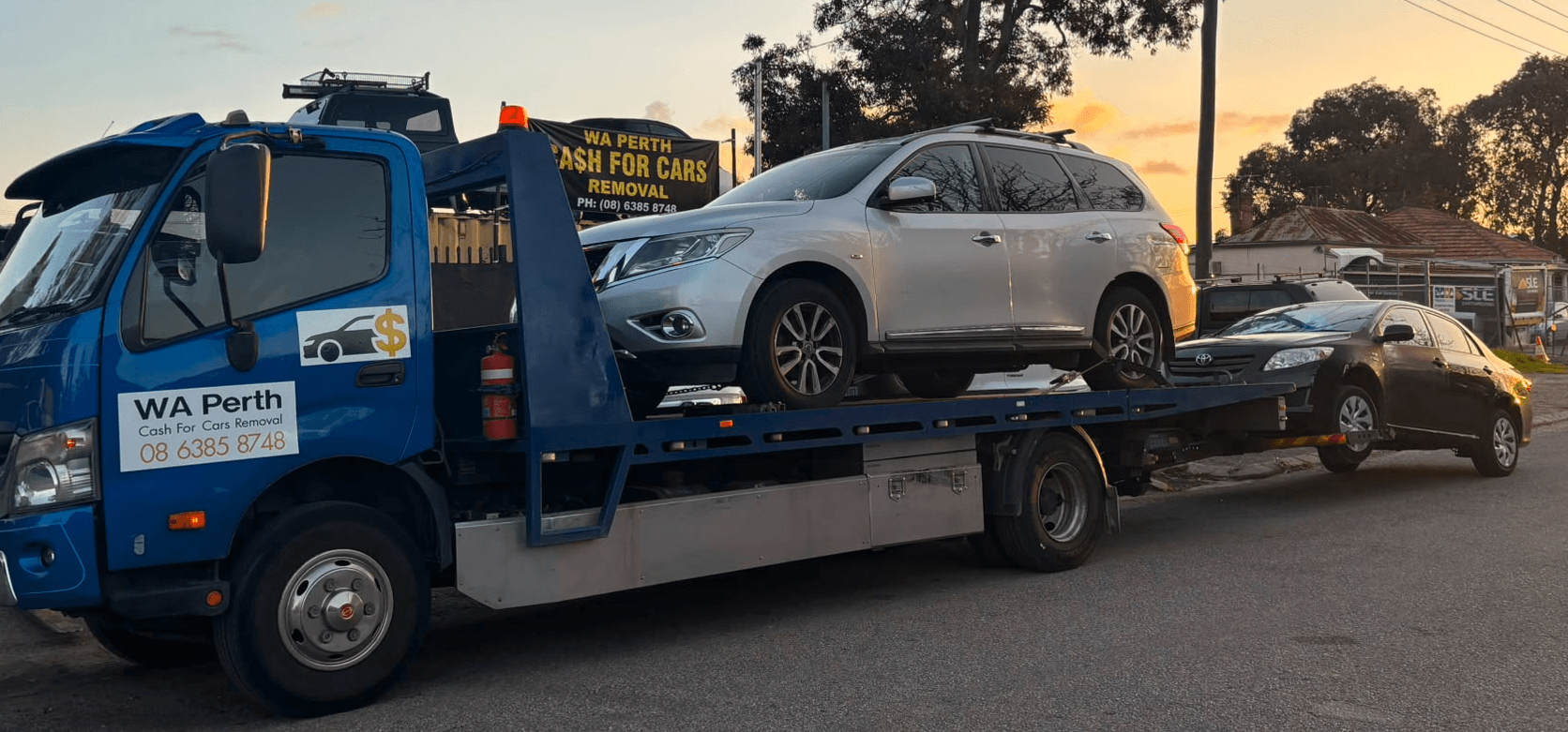 WA Perth Cash For Cars Removal tow truck picking up a vehicle in Perth at sunset
