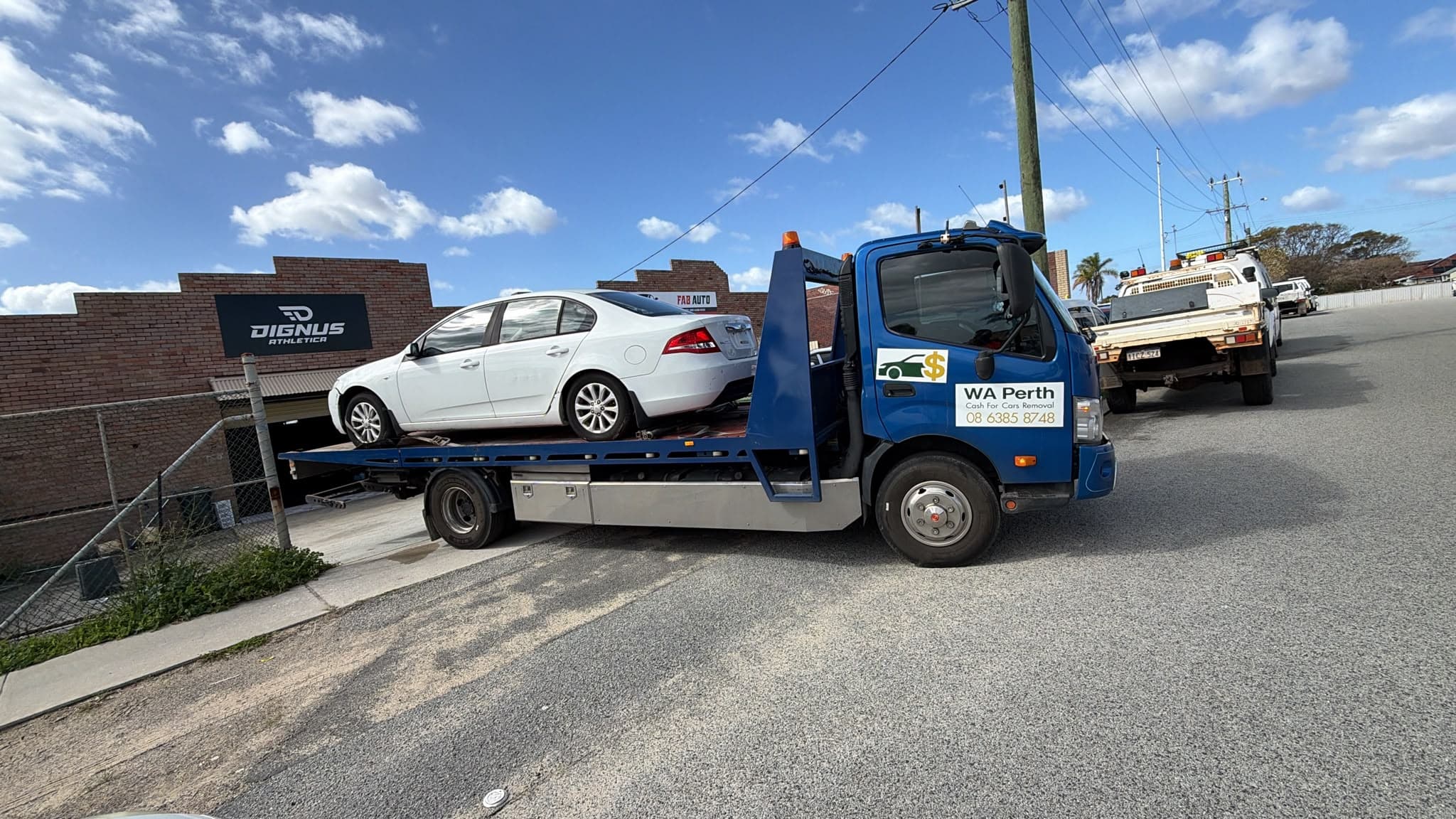 WA Perth Cash For Cars Removal tow truck collecting a 2010 Ford Falcon in Dianella, Perth