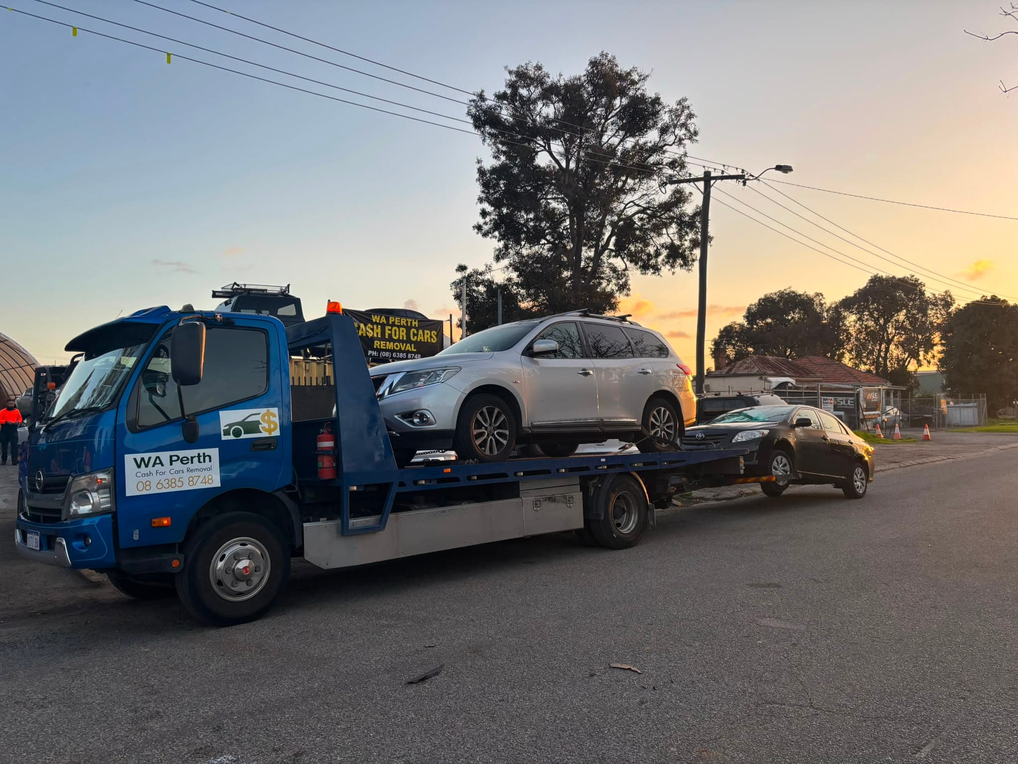 WA Perth Cash For Cars Removal tow truck loading a vehicle on a Perth suburban street